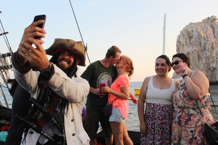 a group of people standing on a boat