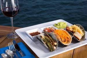 a plate of food and a glass of wine