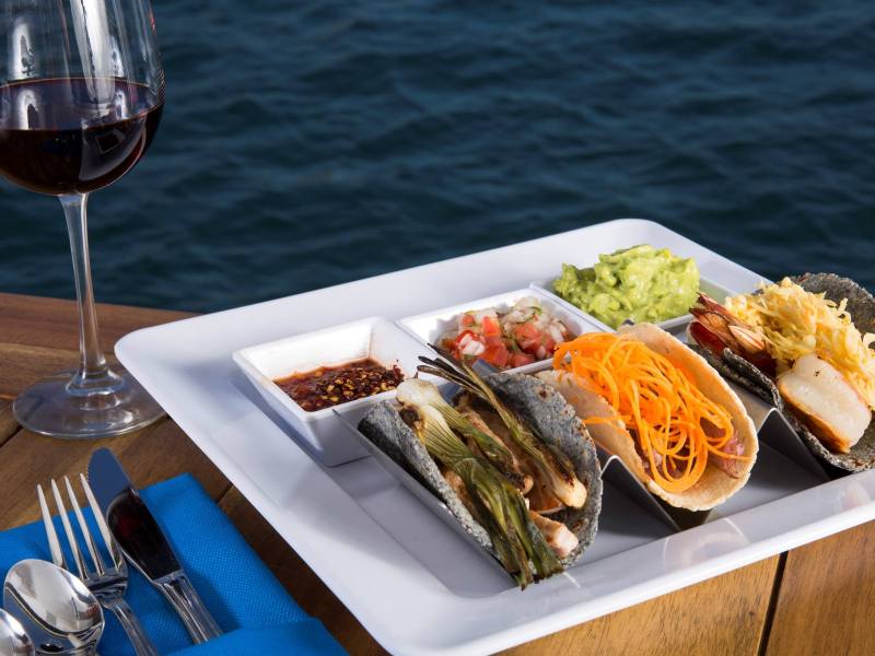 a plate of food and a glass of wine