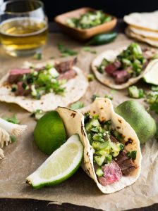 a taco sitting on top of a wooden table