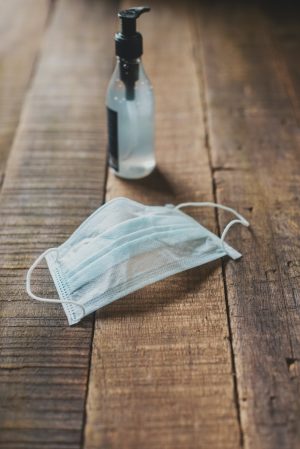 a close up of a wooden table with sanitizing elements over it