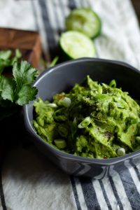 a bowl of food with avocado