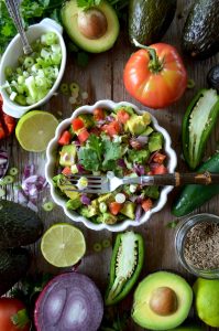 a bowl of fruit and vegetables on display