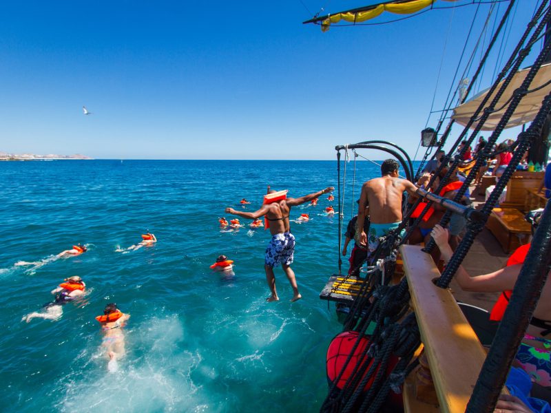 a group of people on a boat in the water